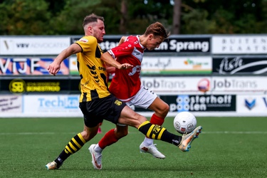 312077